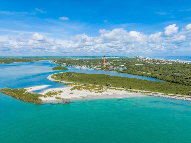 bird's eye view featuring a water view and a view of the beach