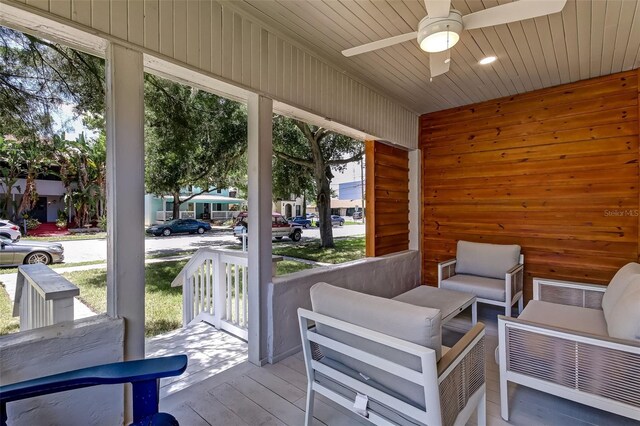 sunroom / solarium with plenty of natural light and ceiling fan