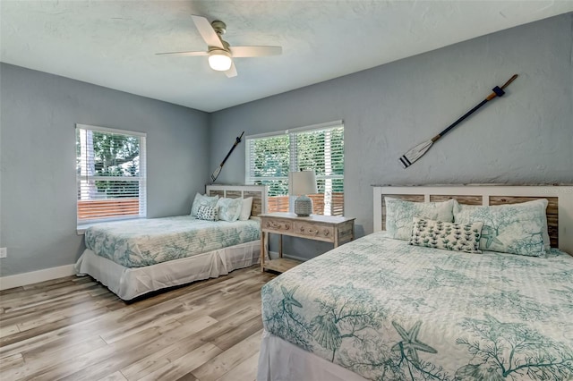 bedroom featuring ceiling fan and hardwood / wood-style floors