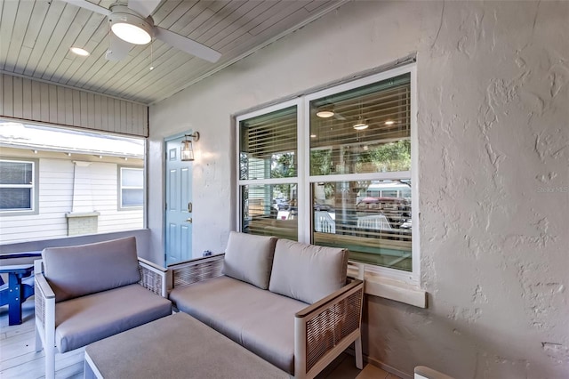 interior space featuring wooden ceiling and ceiling fan