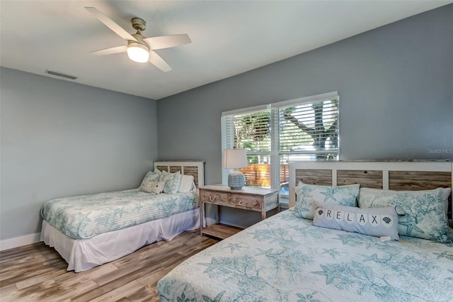 bedroom featuring ceiling fan and wood-type flooring