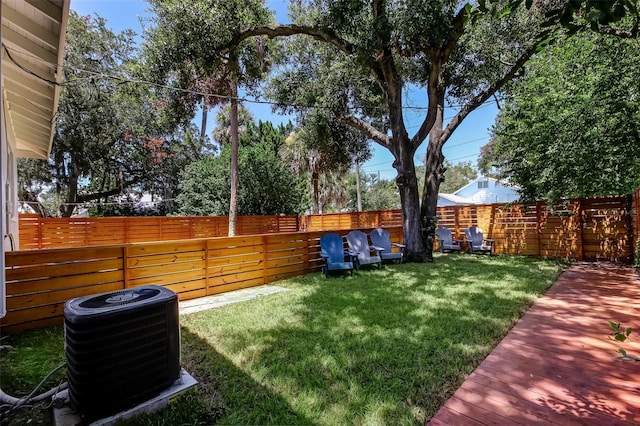 view of yard featuring central air condition unit