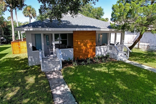 view of front of house featuring a porch and a front lawn