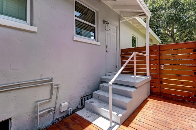 property entrance featuring a deck