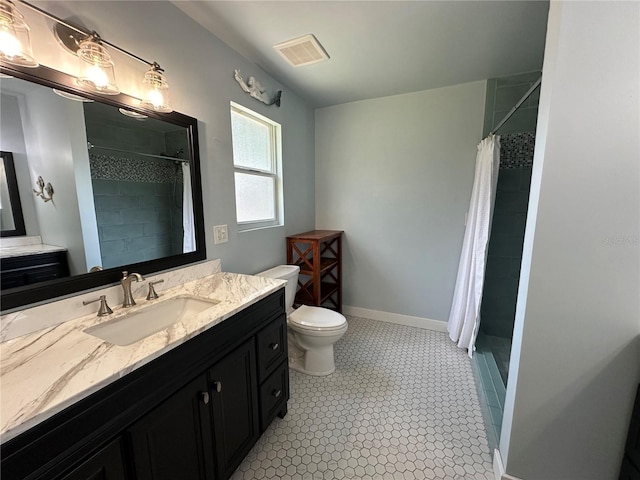 bathroom with vanity, toilet, and curtained shower