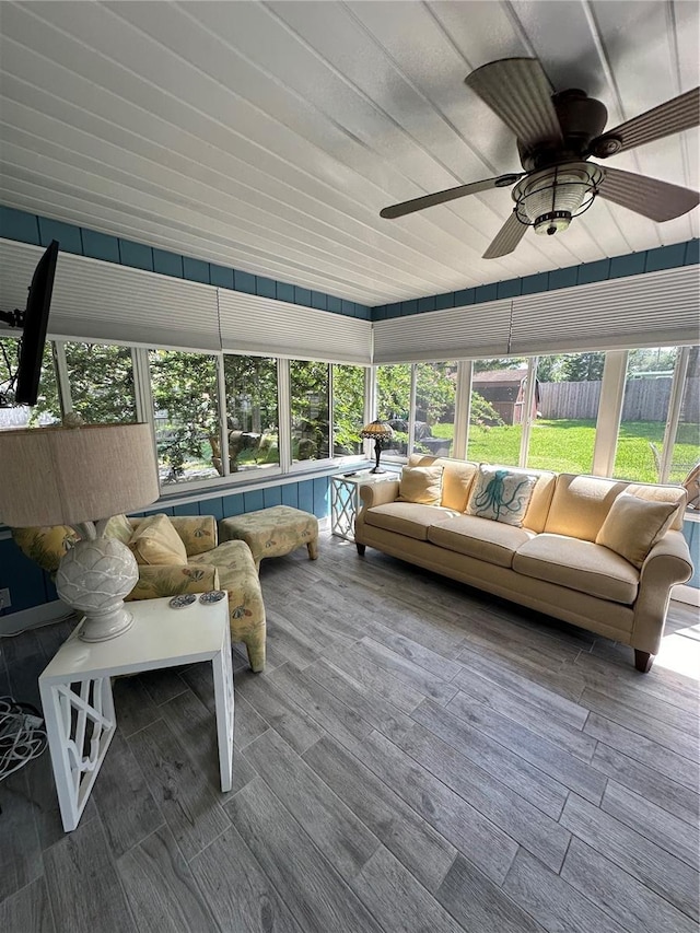 sunroom featuring ceiling fan