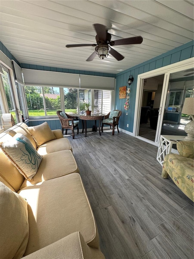 sunroom / solarium with ceiling fan