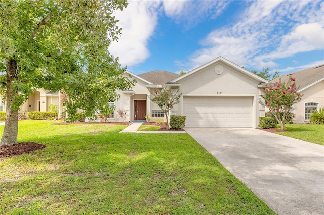 view of front of home with a garage and a front lawn