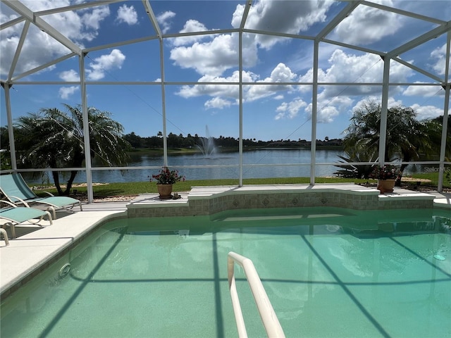 view of pool featuring a lanai and a water view