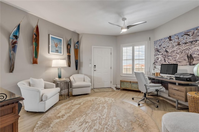 office space featuring light hardwood / wood-style flooring and ceiling fan