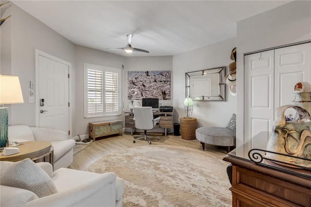 home office with ceiling fan and wood-type flooring