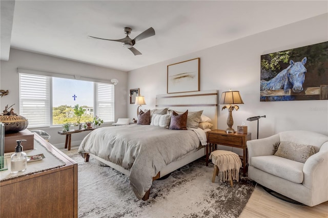 bedroom featuring light wood-type flooring and ceiling fan