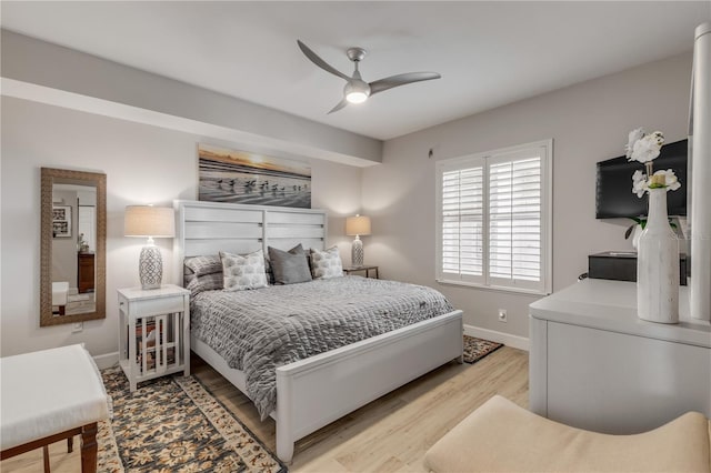 bedroom with ceiling fan and light hardwood / wood-style floors