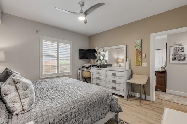 bedroom featuring light hardwood / wood-style floors and ceiling fan