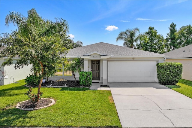 ranch-style house with a garage and a front lawn