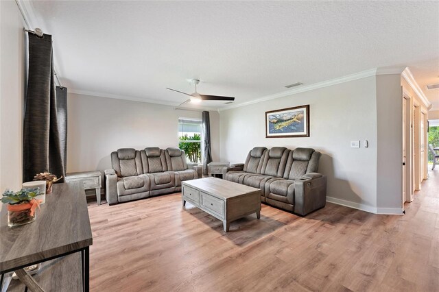 living room with ceiling fan, crown molding, and hardwood / wood-style flooring