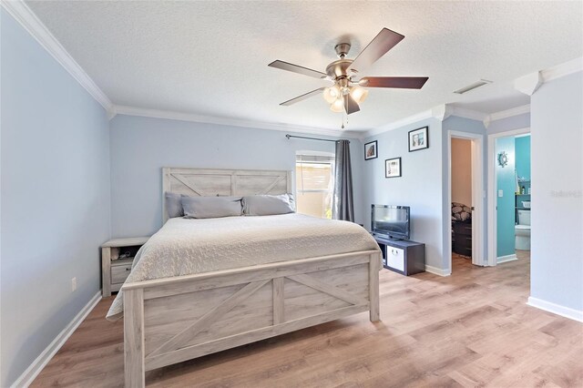 bedroom with a textured ceiling, ceiling fan, crown molding, and light hardwood / wood-style flooring