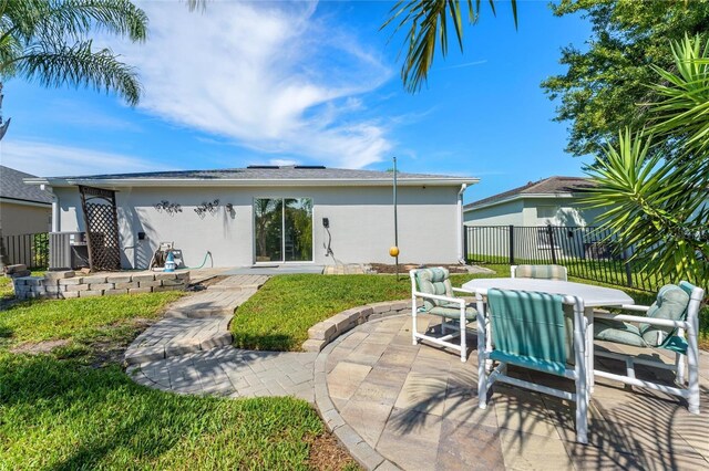 rear view of house with a patio