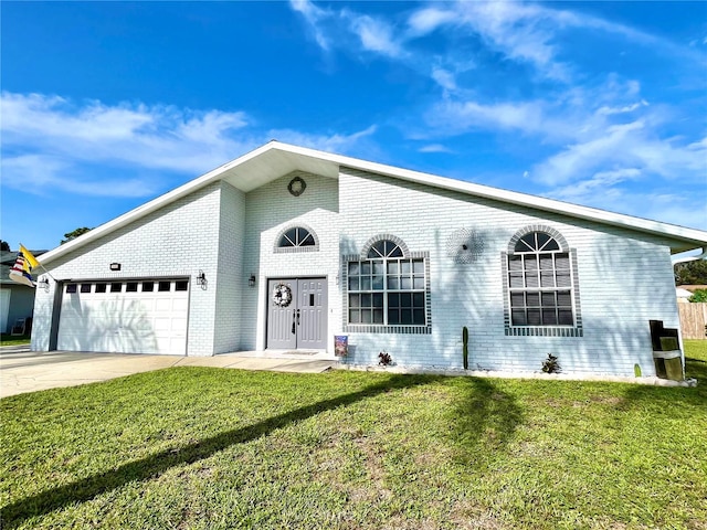 ranch-style house with a garage and a front lawn