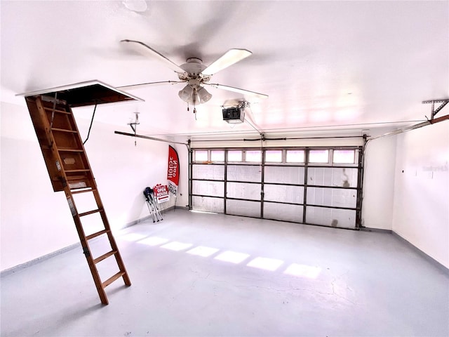 garage featuring ceiling fan and a garage door opener