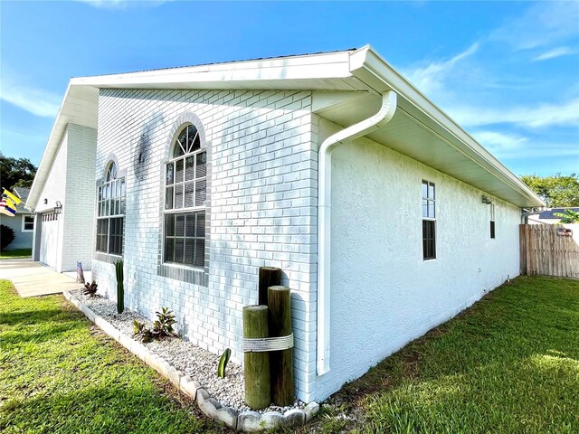 view of home's exterior with a lawn