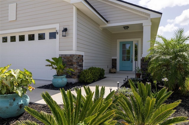 doorway to property featuring a garage