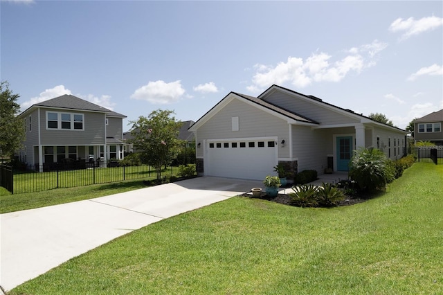 view of front of property with a garage and a front yard