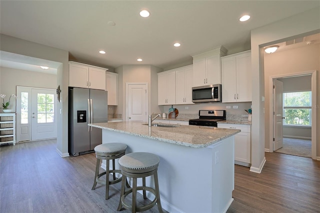 kitchen featuring sink, white cabinets, and stainless steel appliances