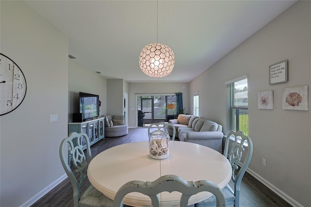 dining space with dark wood-type flooring