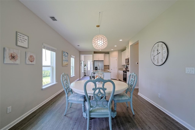 dining room featuring dark wood-type flooring