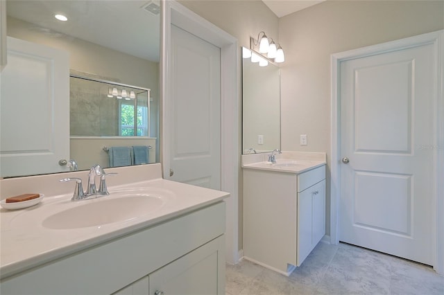 bathroom featuring vanity, a shower, and tile patterned flooring