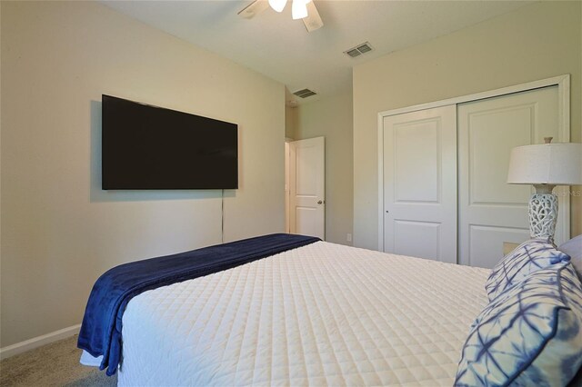 bedroom with carpet floors, a closet, and ceiling fan