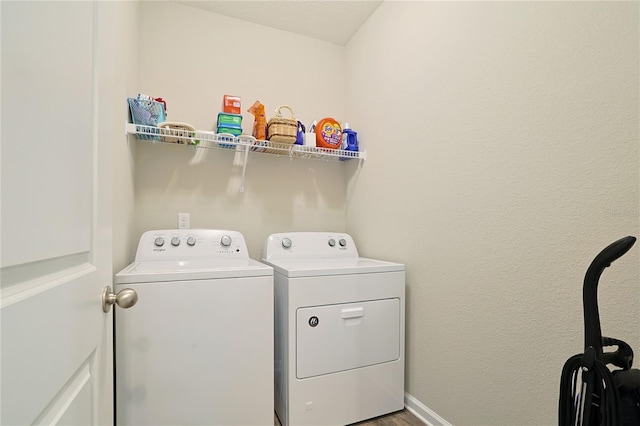 laundry room with separate washer and dryer