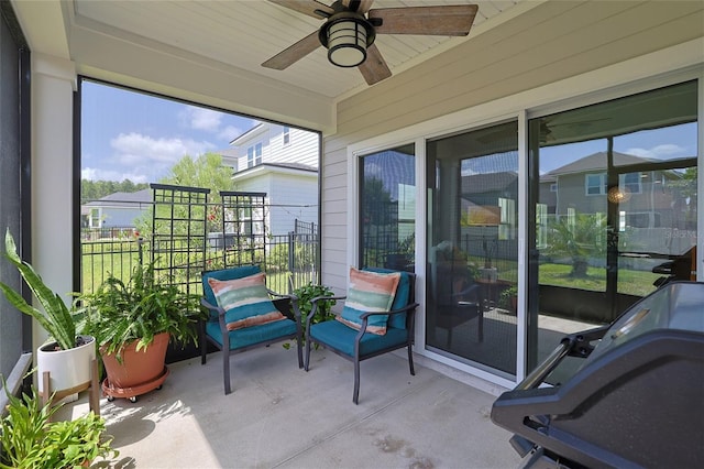 exterior space featuring ceiling fan