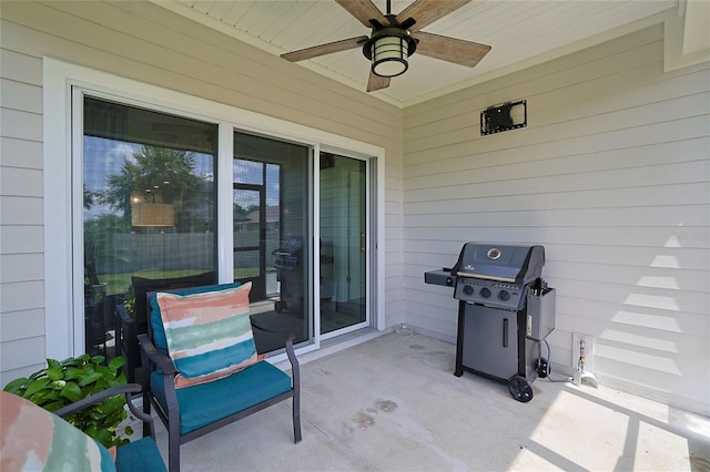 view of patio featuring ceiling fan and a grill