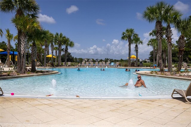 view of pool with pool water feature