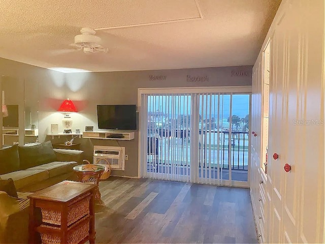 living room featuring hardwood / wood-style flooring and a textured ceiling