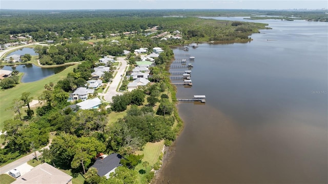 bird's eye view with a water view and a forest view