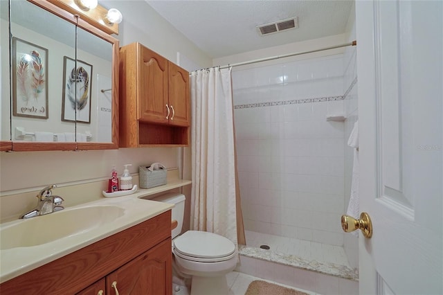 full bath with a textured ceiling, toilet, vanity, visible vents, and tiled shower