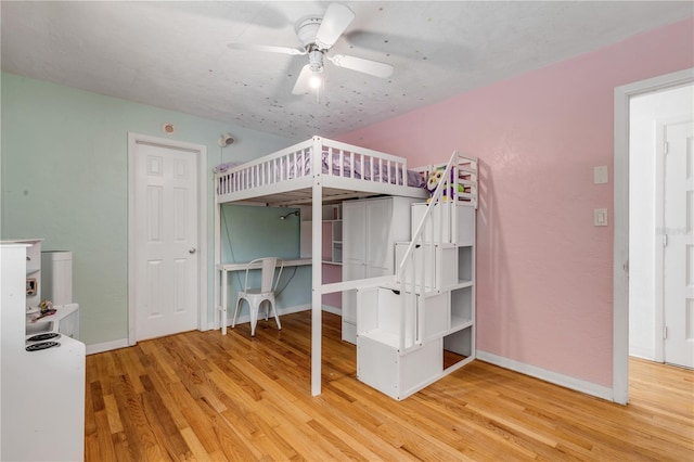 unfurnished bedroom featuring ceiling fan and hardwood / wood-style floors