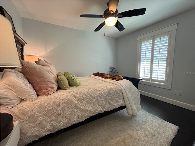 bedroom featuring ceiling fan and hardwood / wood-style floors