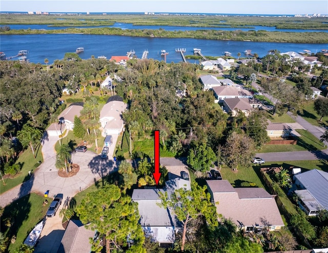 birds eye view of property featuring a residential view and a water view