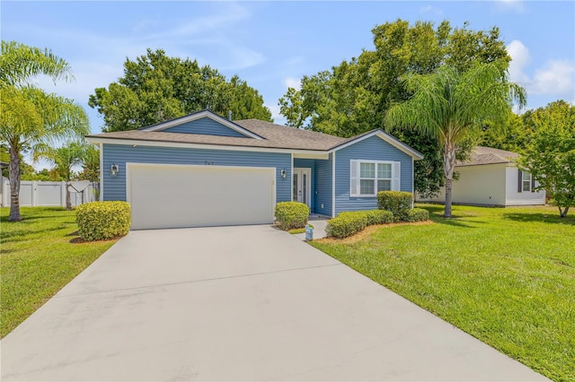 single story home featuring a garage and a front yard