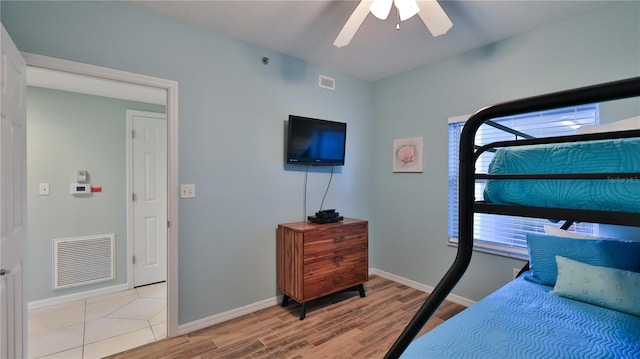 bedroom with light wood-type flooring and ceiling fan