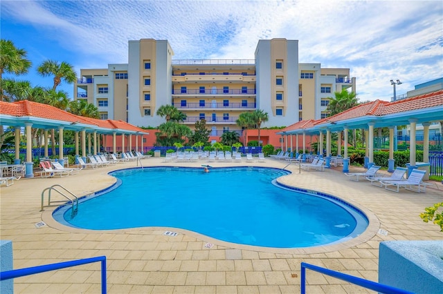 view of swimming pool with a patio area