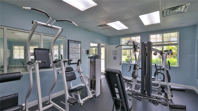 workout area featuring a paneled ceiling