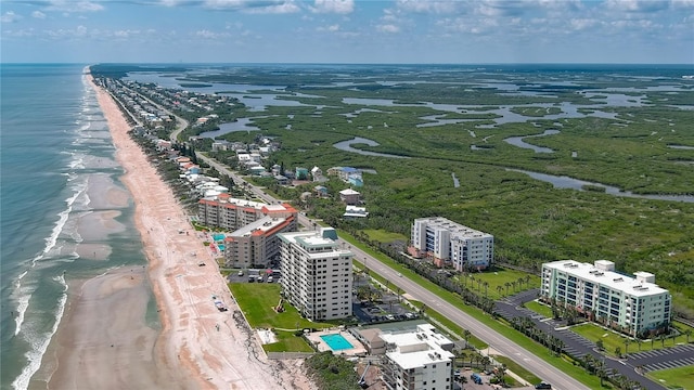 aerial view featuring a view of the beach and a water view