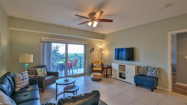 tiled living room featuring ceiling fan