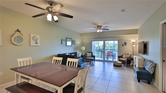 tiled dining space featuring ceiling fan