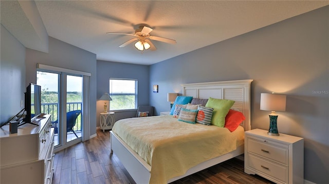 bedroom featuring access to outside, ceiling fan, and dark wood-type flooring